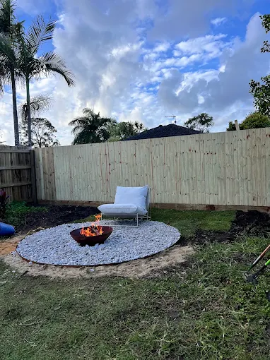 New timber paling fence backdrop for a firepit in a Sunshine Coast backyard